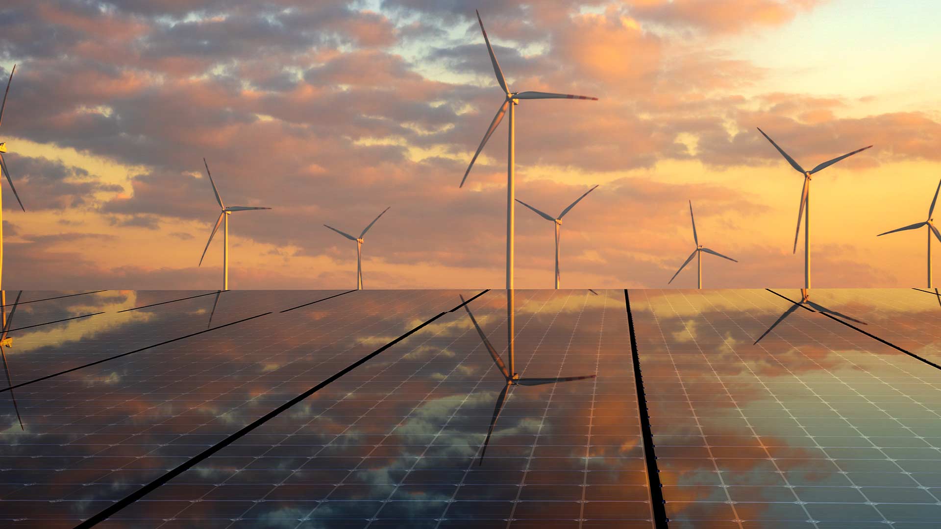 Wind turbine farm set against an outdoor backdrop of pastel colored skies and clouds. 